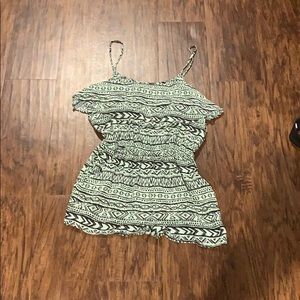 Patterned teal romper with cut out on the back